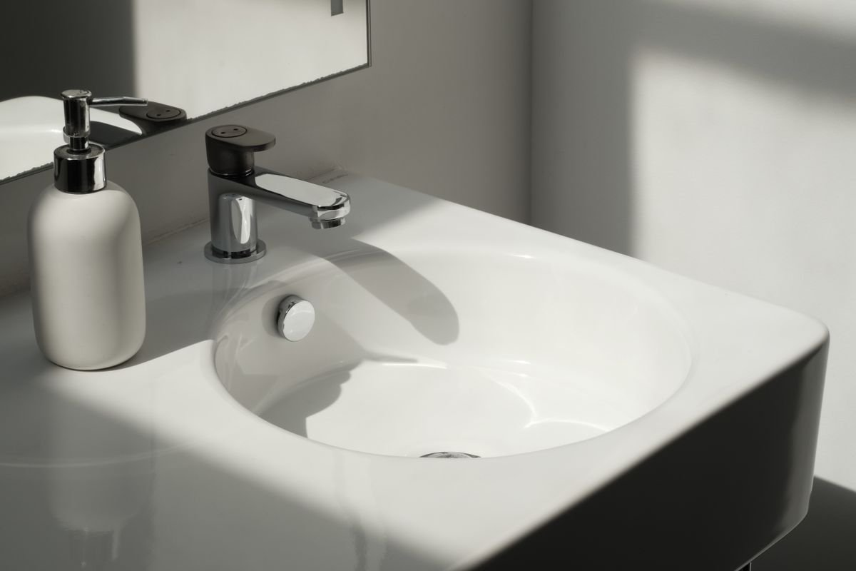 White bathroom sink with chrome faucet
