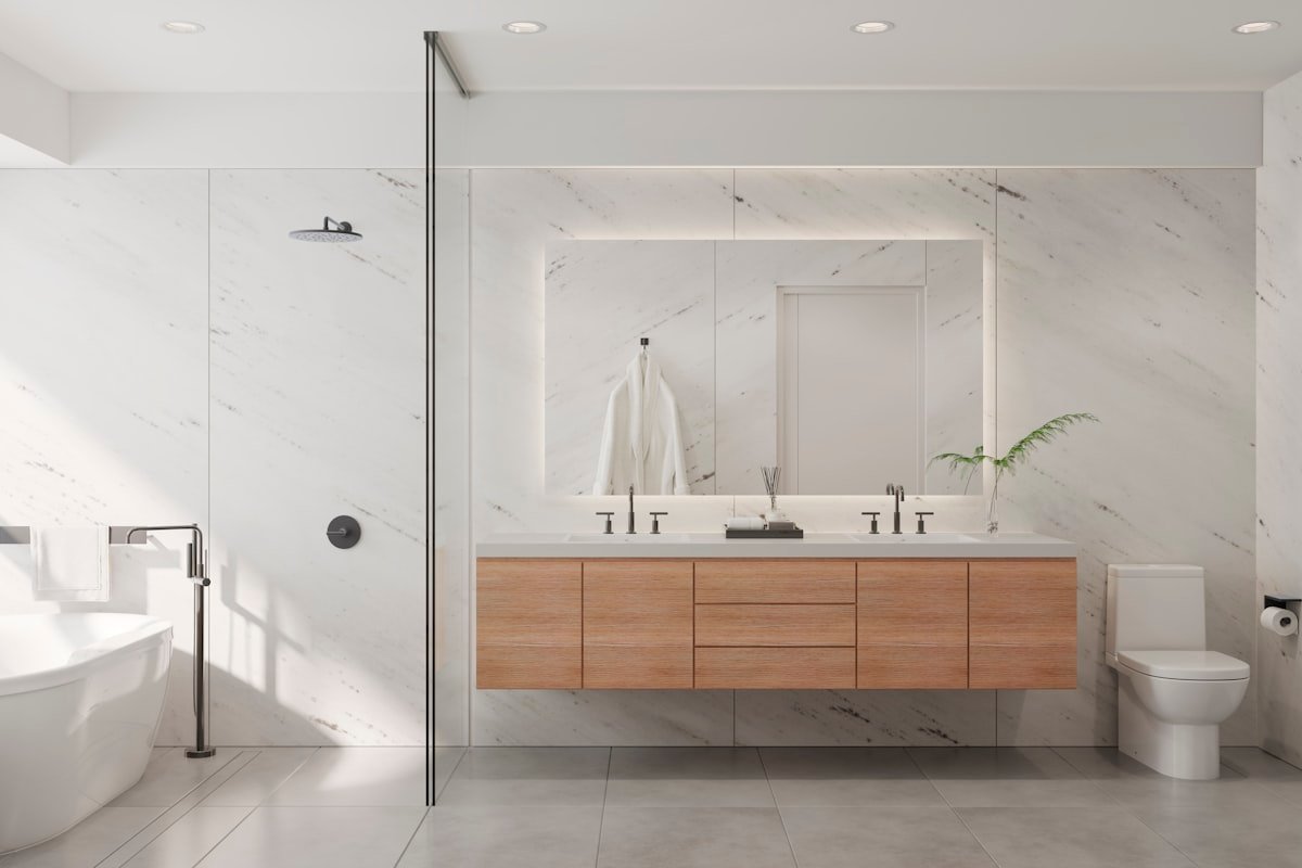 Empty bathroom with bathtub, sink and mirror ready for installation