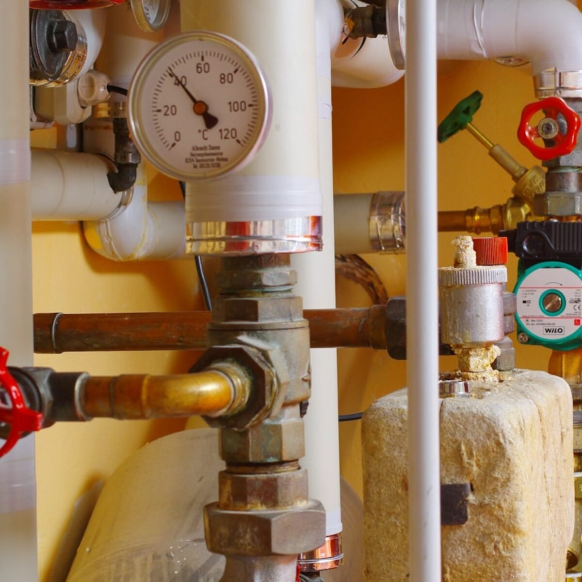 Boiler pipework and pressure gauges typical of a combi installation, square crop