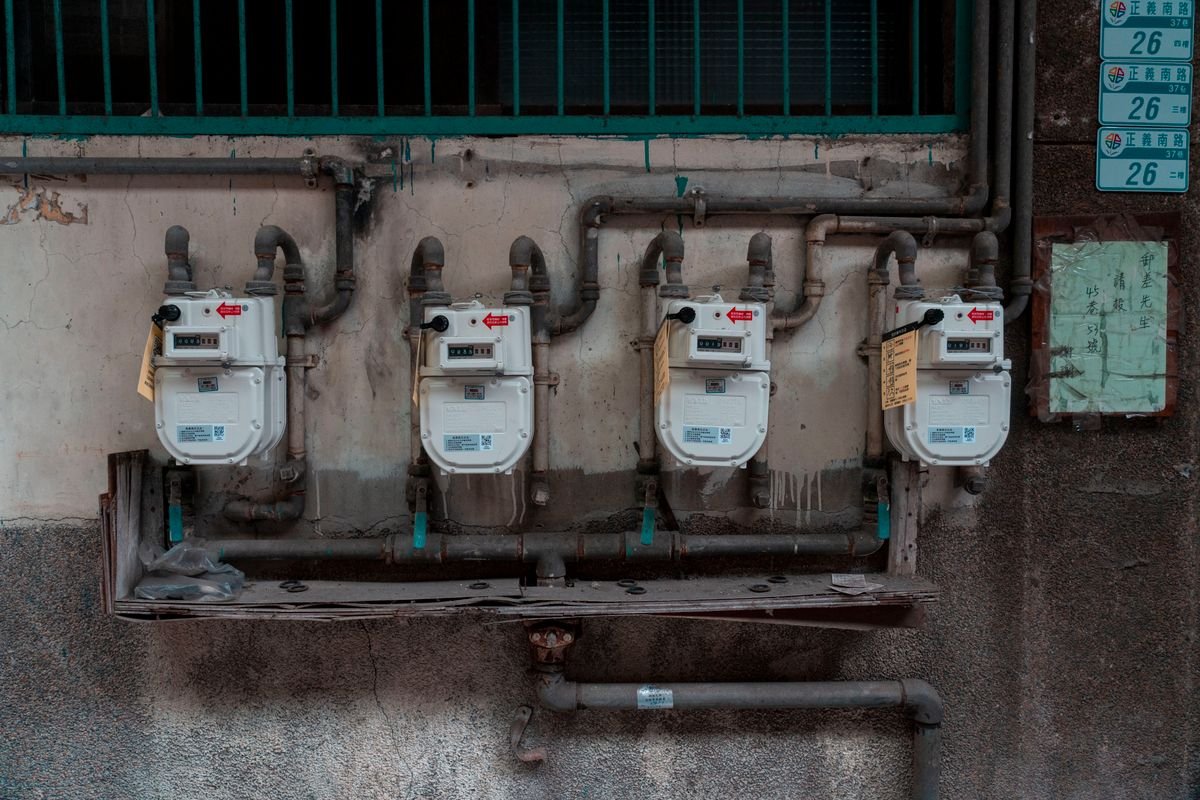 Four gas meters mounted on an exterior wall