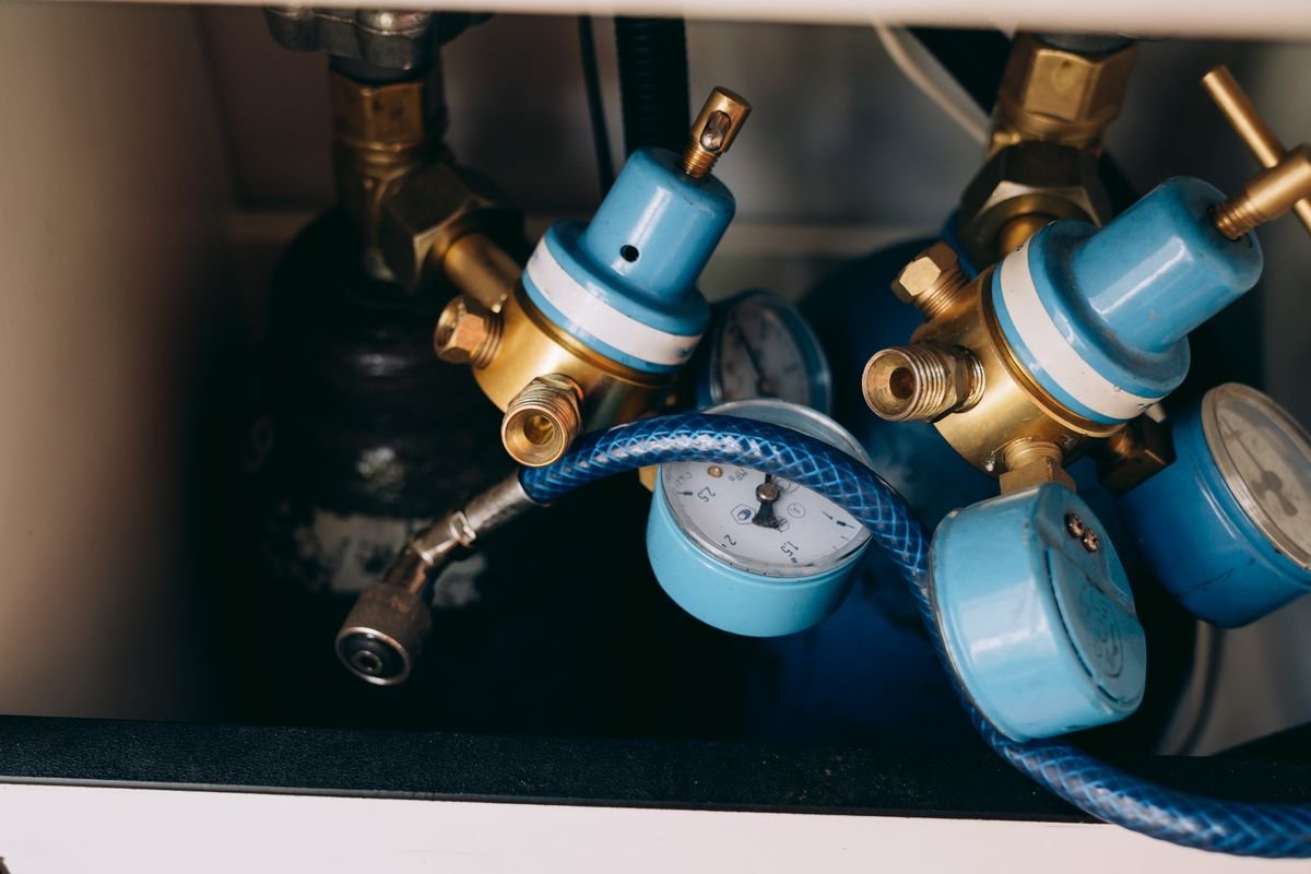 Brass gas pressure regulators with gauges and tubing