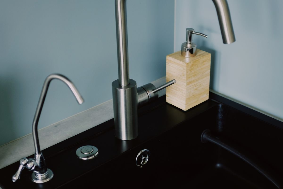 Modern kitchen sink with steel faucet