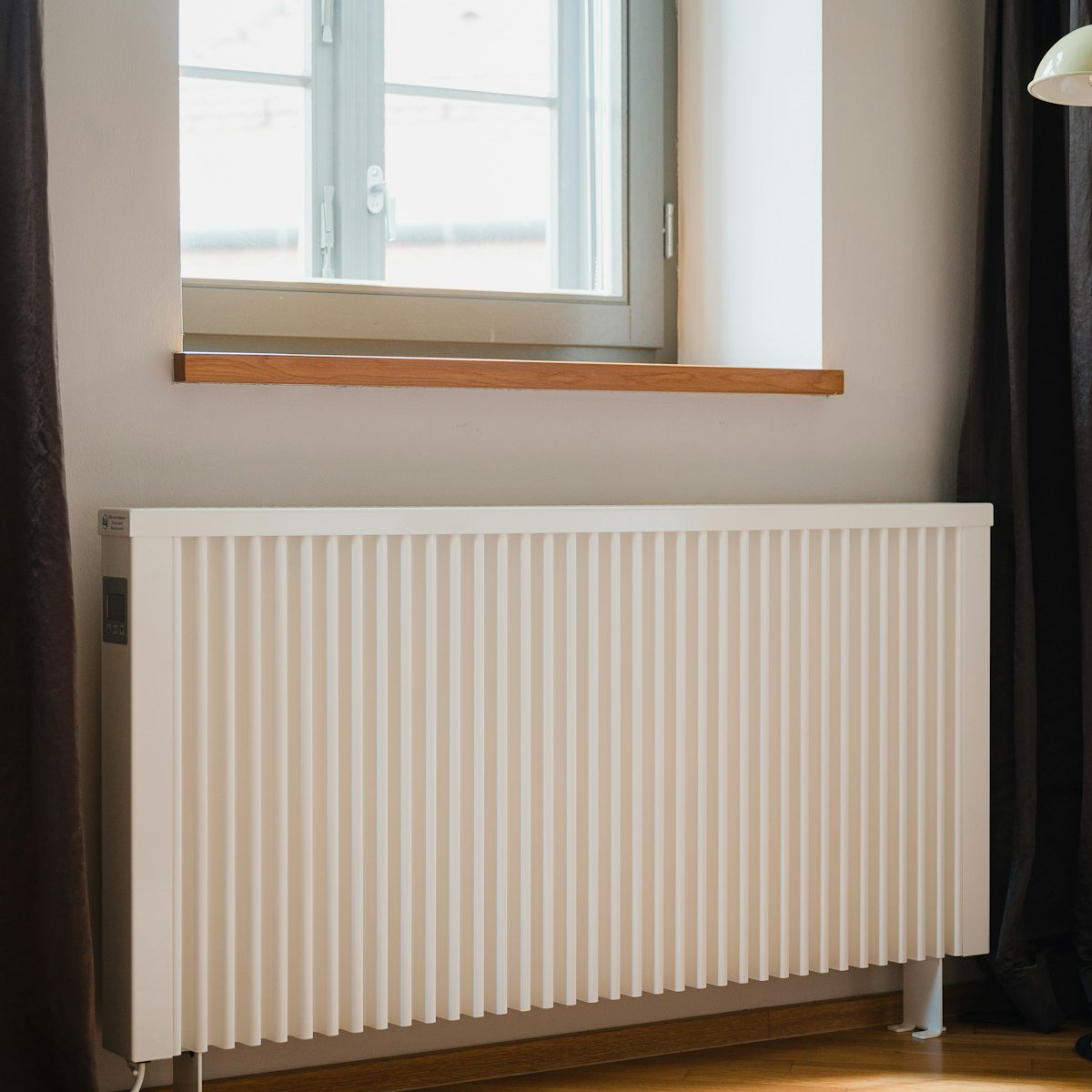 White radiator installed as part of a central heating upgrade