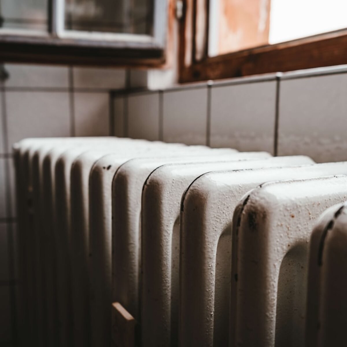 Radiator connected to a traditional regular boiler heating system, square crop