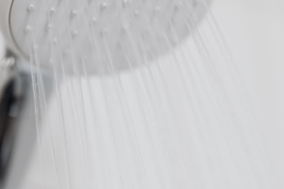 Modern shower head in a white bathroom