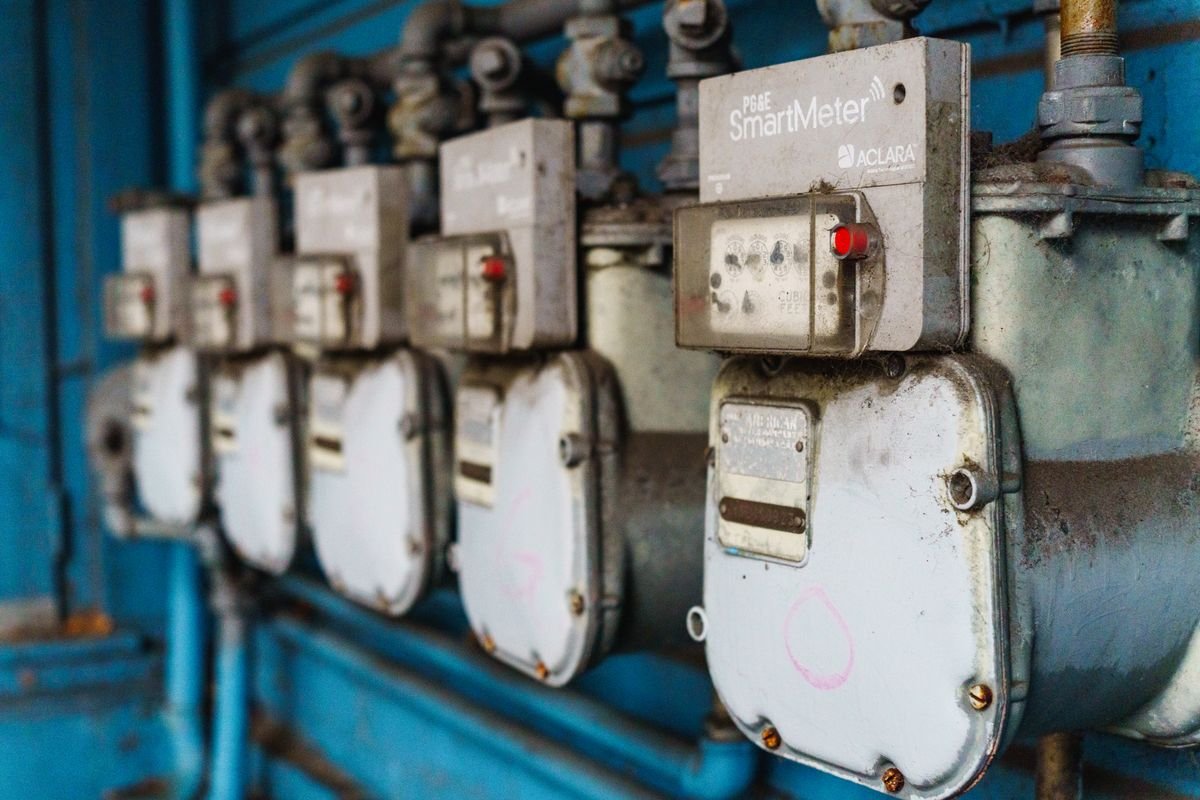 Row of smart utility meters on a wall